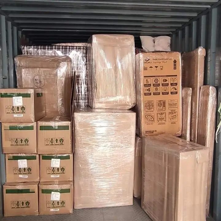 A container packed tightly with cartons and wrapped items